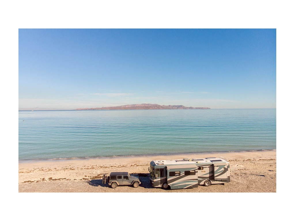 Journey parked on the beach with slides extended