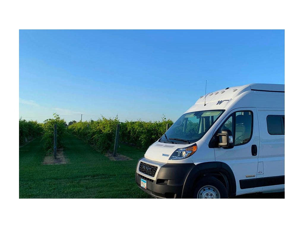 Front end of the Solis next to trees