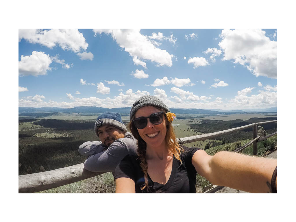 Ashley and Jessie taking a selfie overlooking a beautiful mountain view