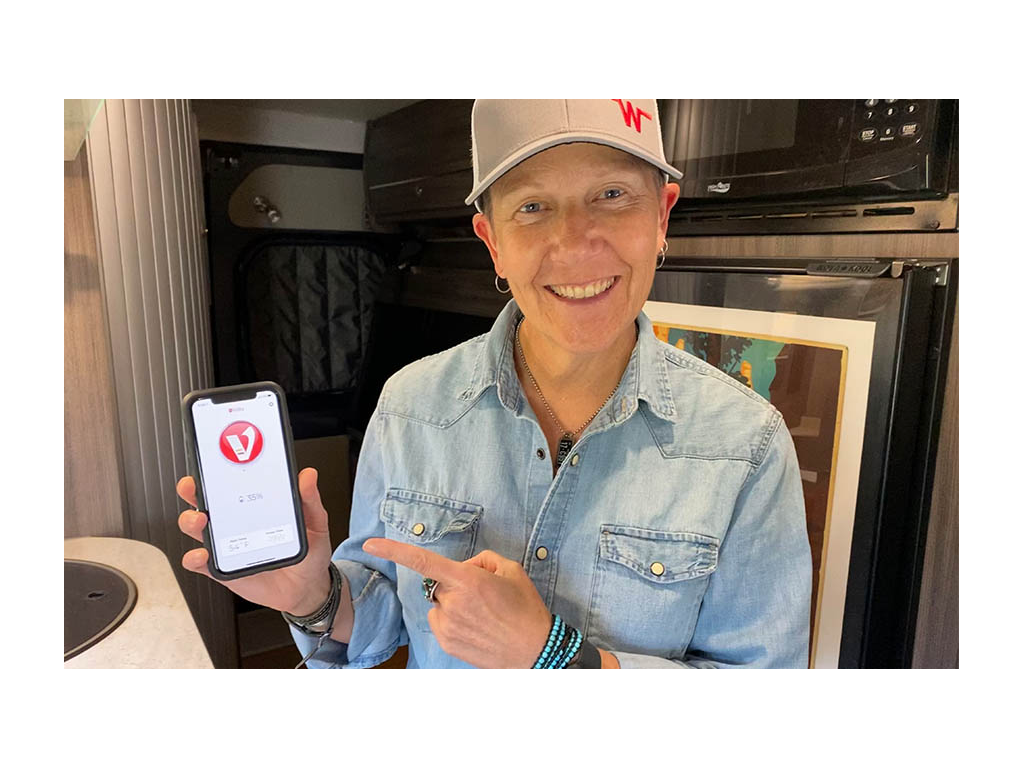 Noel showing off Volta app on phone screen