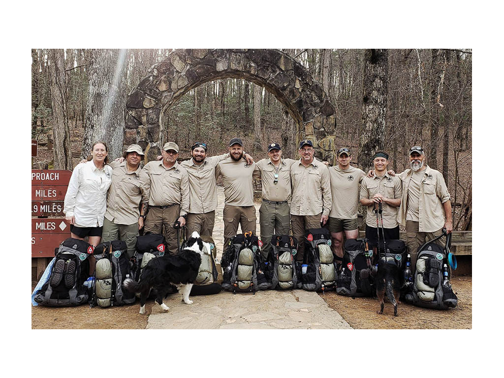Warrior Expeditions group at trail head with gear