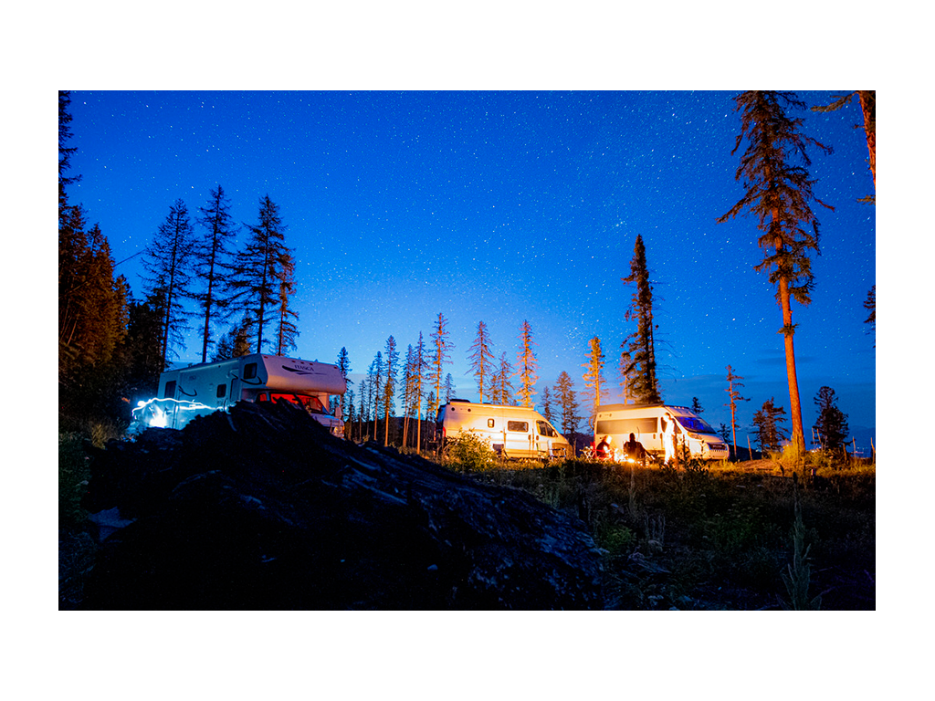 A Winnebago Itasca evening with the Class C and two Winnebago Class B vans