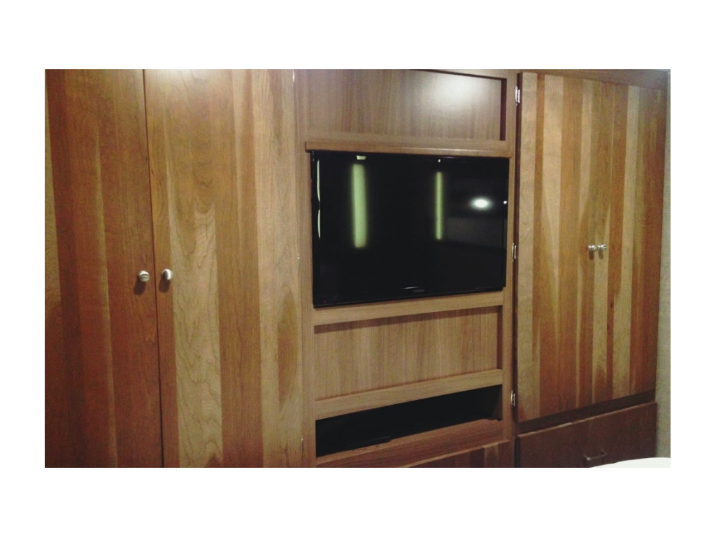 Bedroom cabinetry and TV.