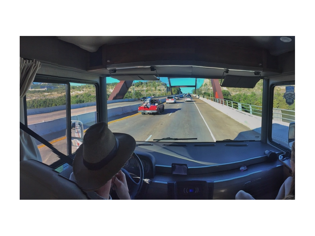 Heath driving along a busy highway.