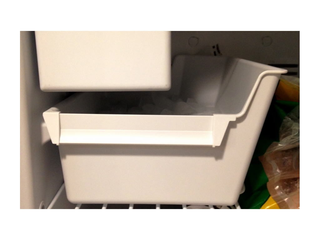 Ice maker in the freezer. 