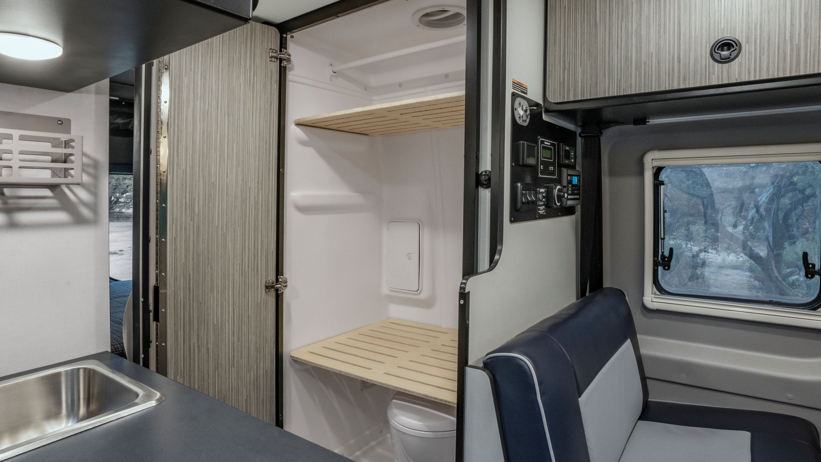 Revel Sport interior with bath and bench seating