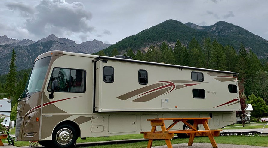 Vista parked at campsite next to picnic table