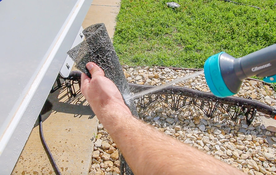 RV Spring Cleaning, detail view of vent filter being cleaned