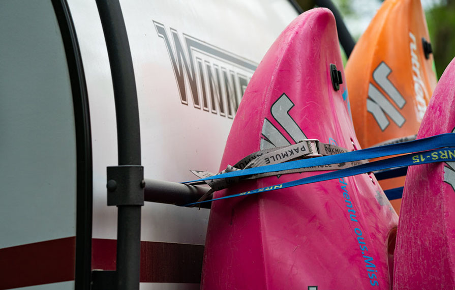 Close up shot of kayaks strapped to back of HIKE
