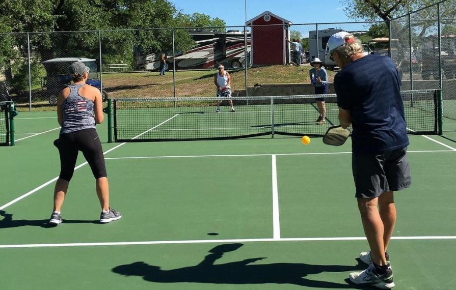 Ann and Lin playing pickleball with two others