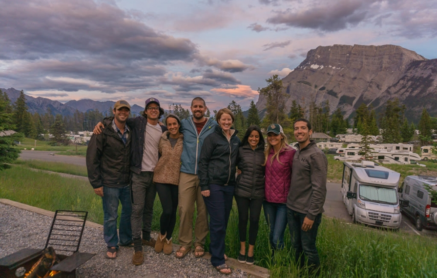 Dan and Lindsay huddled with friends