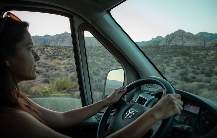 Nadia driving Trend with mountains and desert out the windows