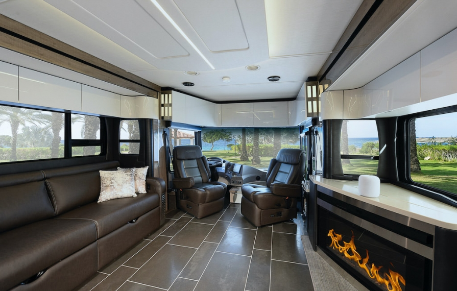 Interior shot of the Horizon showing from middle to front of the coach. Fireplace is on. 