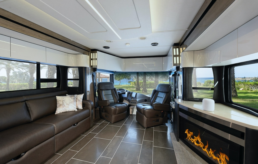 Interior shot of the Horizon showing from middle to front of the coach. Fireplace is on.