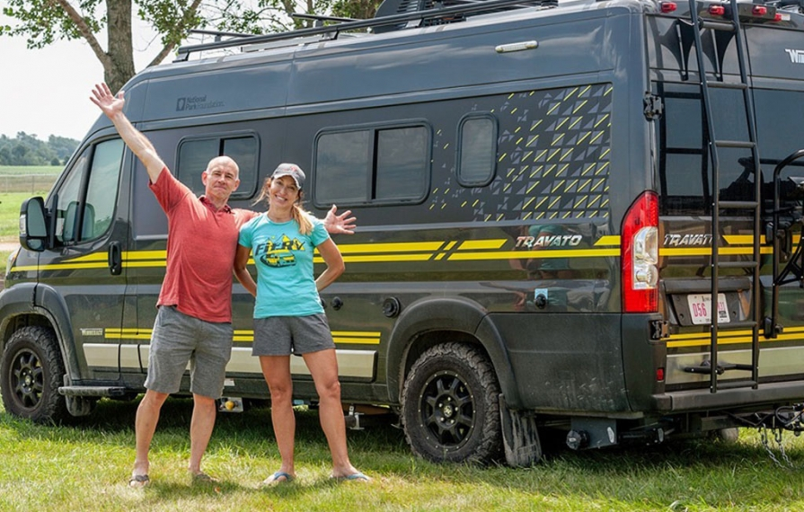 James and Stef standing in front of the Limited Edition National Park Foundation Travato