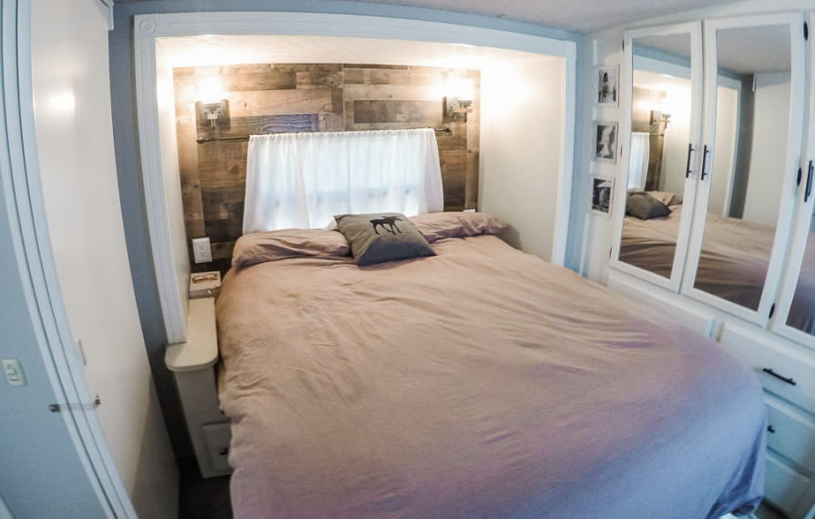 White walls with blue accents in finished bedroom