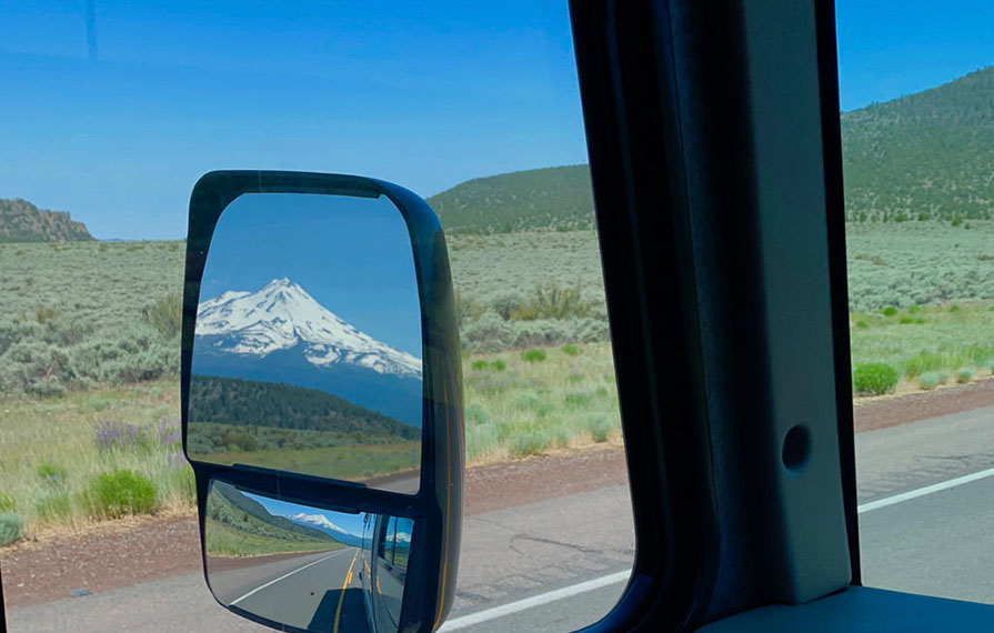 View of Mount Shasta from driver's side mirror of Vista 