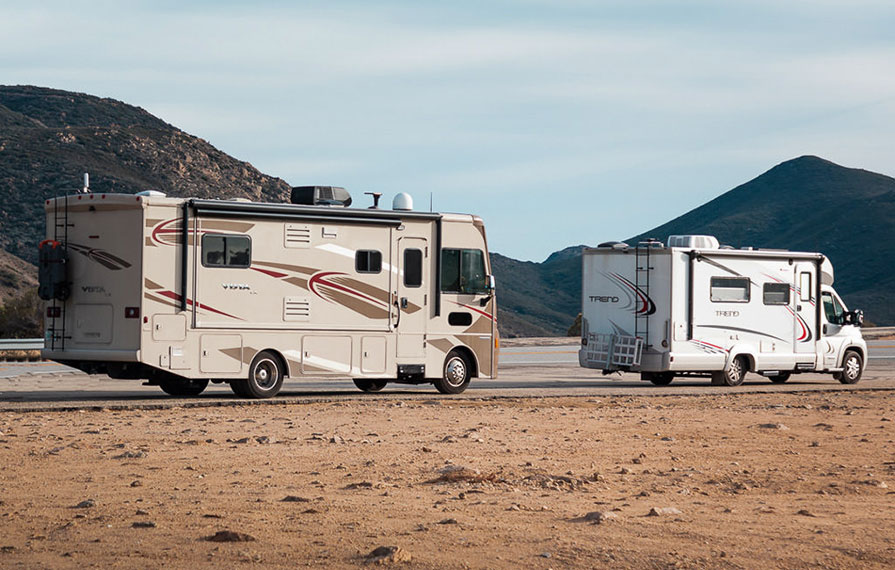 Vista parked behind Trend on road