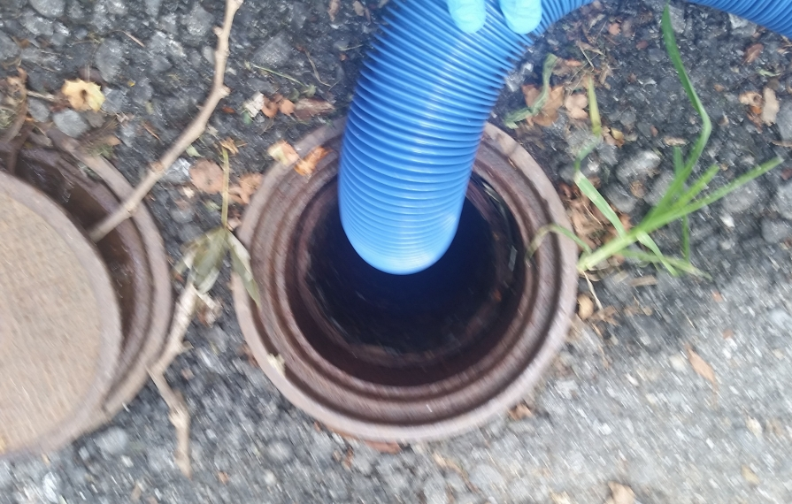 Sewer dump station with hose inside.