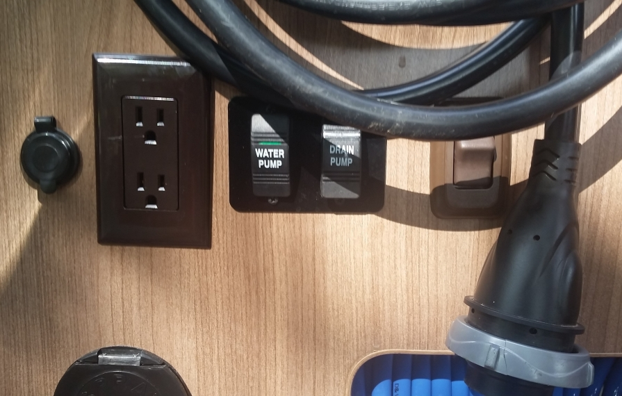 Drain pump button on the interior of the motorhome.