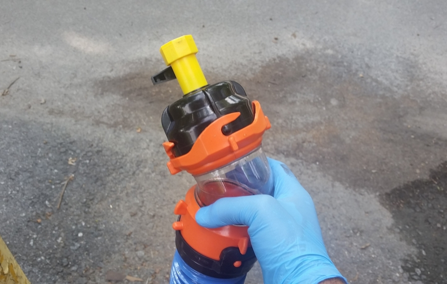 Rinse hose connected to clear elbow.