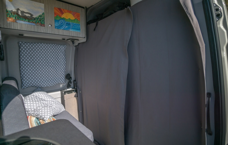 Front interior shot of self-made blackout curtains in a Winnebago Revel