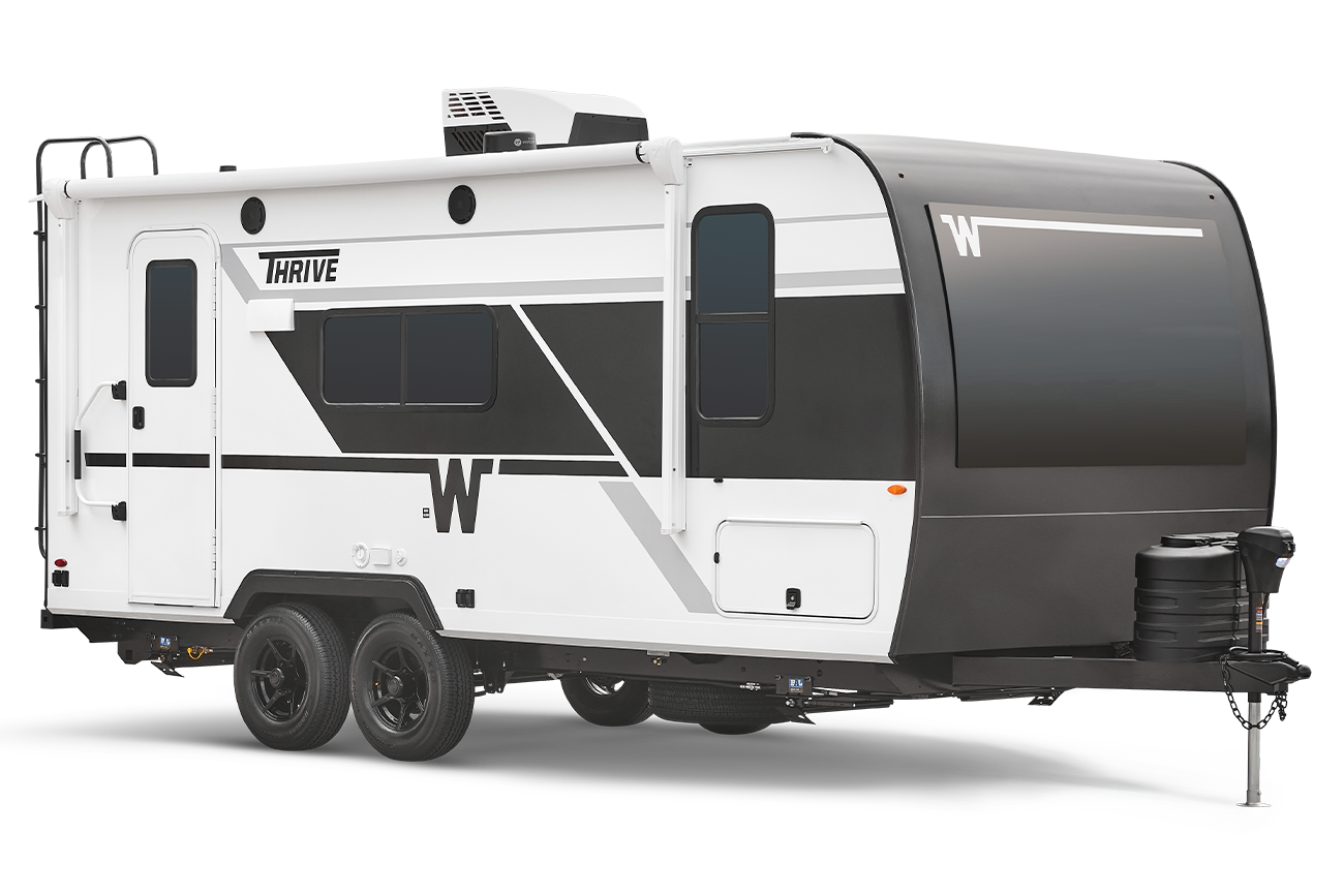 Side profile exterior view of a Winnebago Thrive
