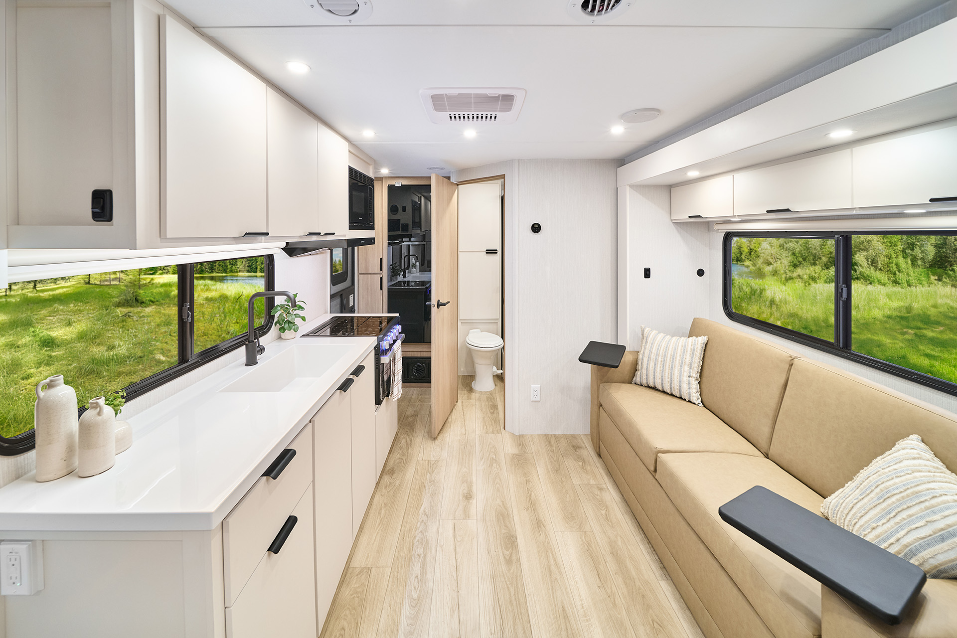 2026 Winnebago Thrive 18FBS — Front to back interior view of Winnebago Thrive 18FBS travel trailer with galley, lounge, and bath