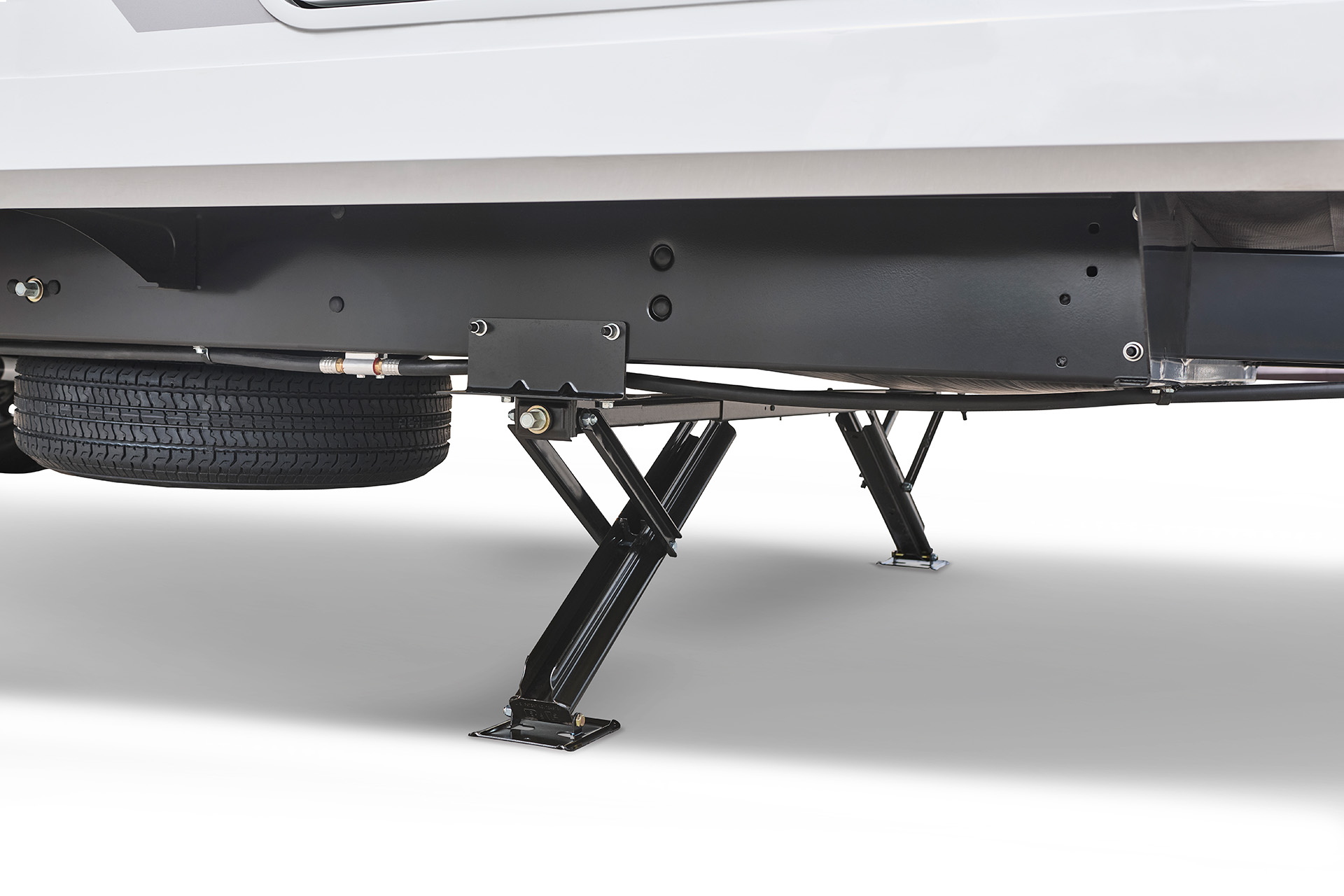 2026 Winnebago Thrive 22RBS — Close up of the stabilizer jacks on a Winnebago Thrive 18FBS