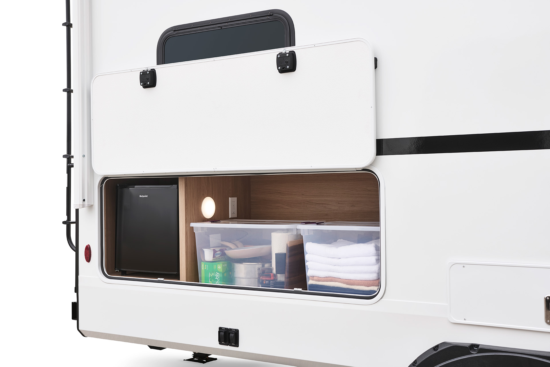 2026 Winnebago Thrive 22MBH — Close up on the exterior storage compartment and fridge of a Winnebago Thrive 22MBH