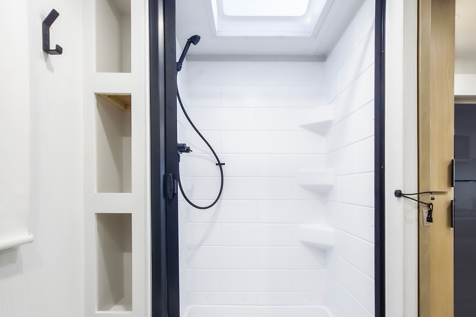 2026 Winnebago Thrive 22RBS — Close up of the bath shower inside a Winnebago Thrive 22RBS