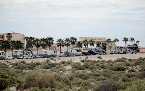 Line of motorhomes entering Playa Bonita.