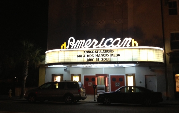 American theater with sign that reads, "Congratulations Mr & Mrs Marcus Ikeda May 31, 2013."