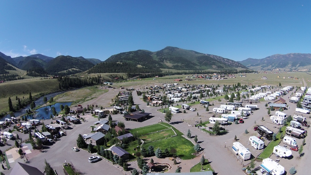 Mountain Views RV Park filled will RVs surrounded by mountains.