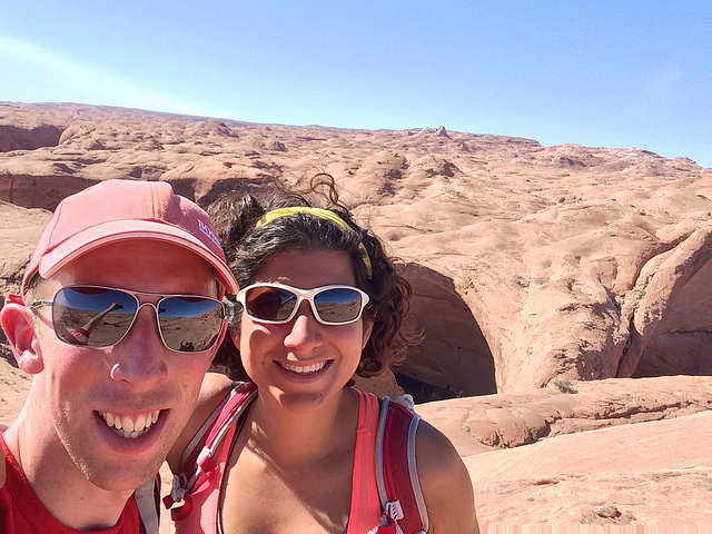 Selfie of a couple on rocky terrain.