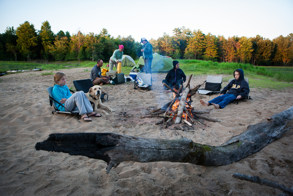 Families relaxing around the campfire after a long day on the river.