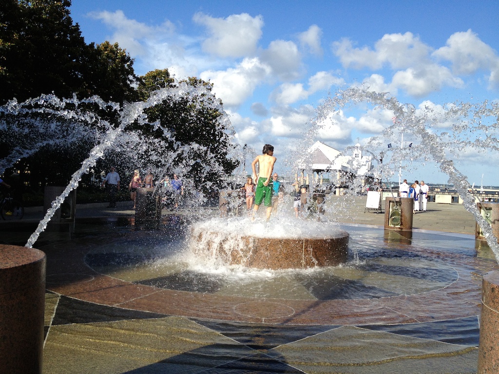 Boy playing a fountain in Charleston, South Carolina