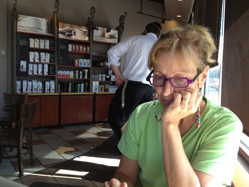 Woman contemplating choices at Starbucks