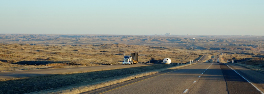 Highway stretching through desert landscape.