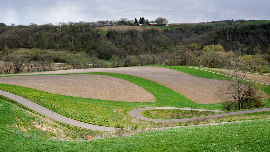 Bike path curving along the hillside and through the farm fields.