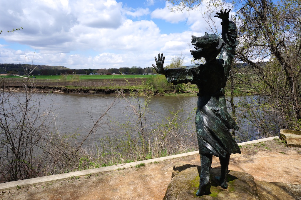 Statue of a girl along the river.