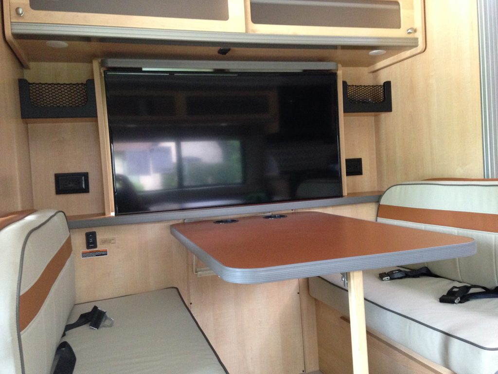 Dinette with TV now in place of where a window was.
