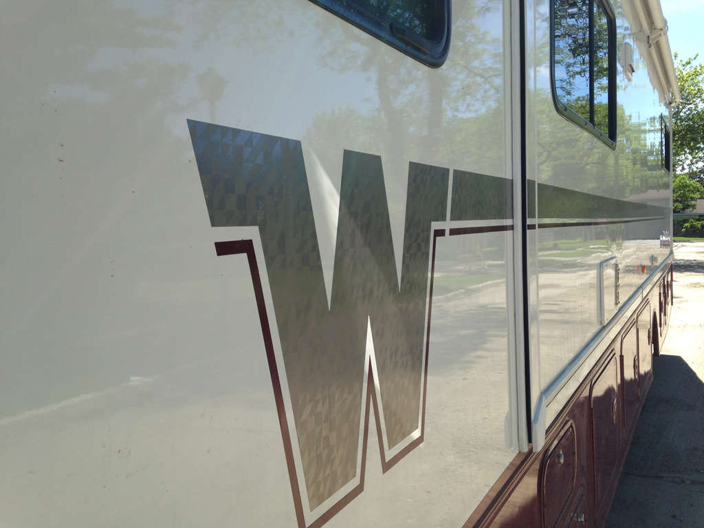Flying W decal down the side of the Winnebago Brave.