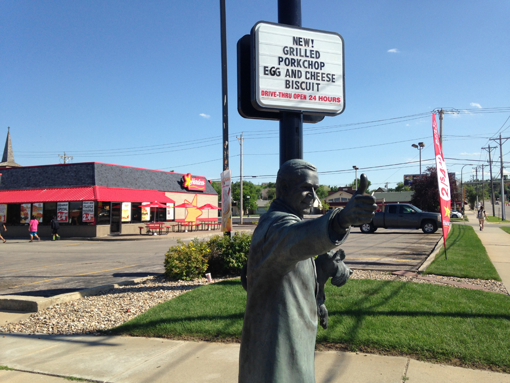 George W Bush statue in front of a Hardees.