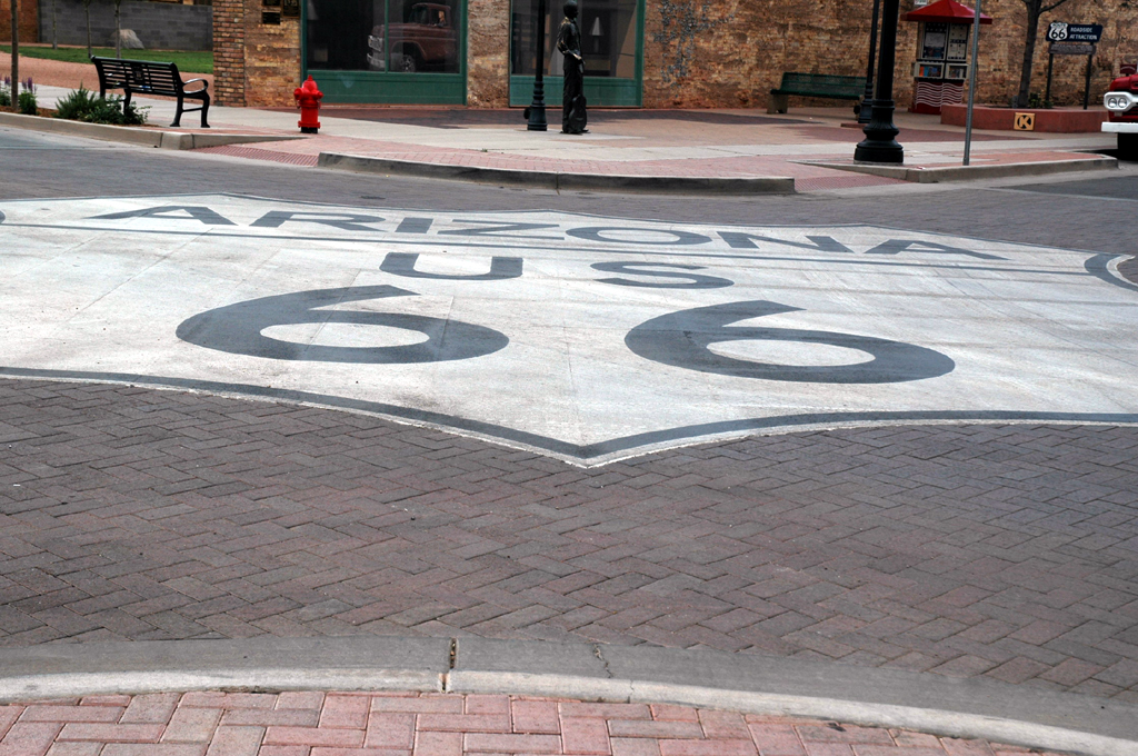 Arizona US 66 painted on cobblestone road.