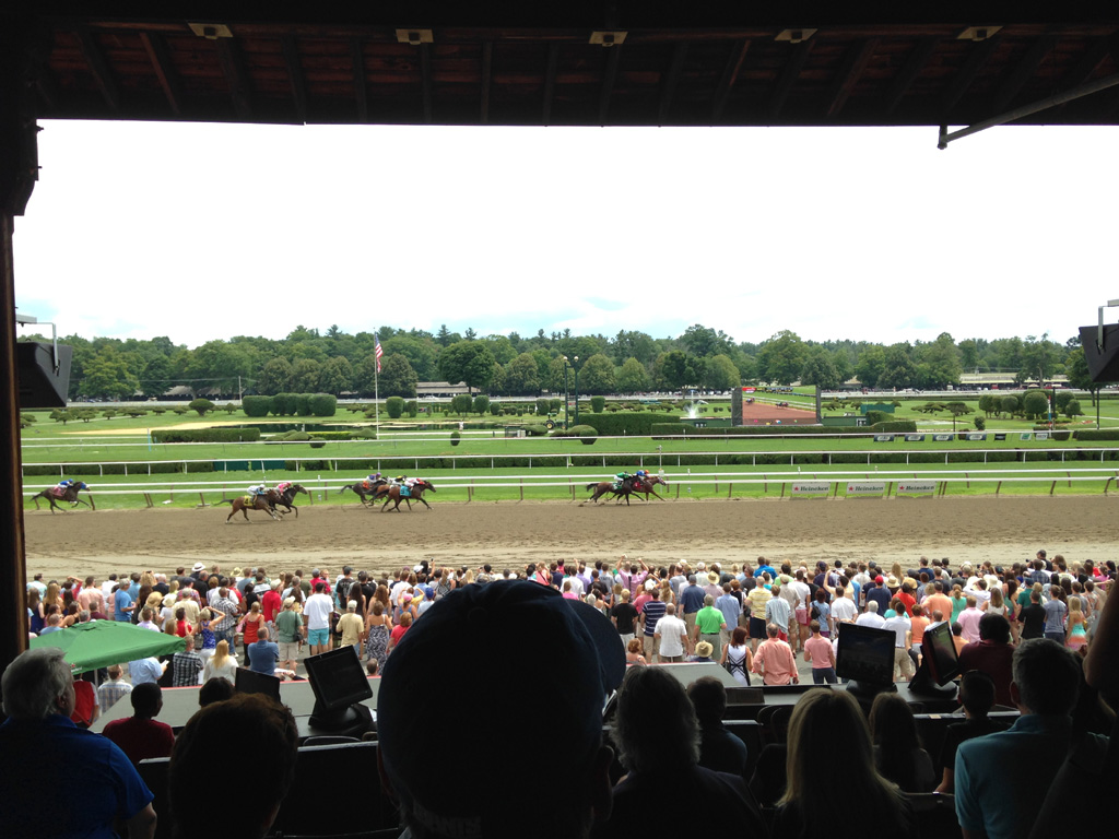 Horses racing on Saratoga Race Course.
