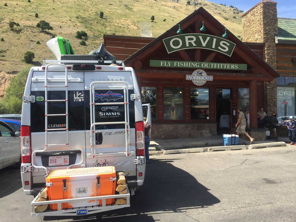 Winnebago Travato parked in front of Orvis Fly Fishing Outfitters.
