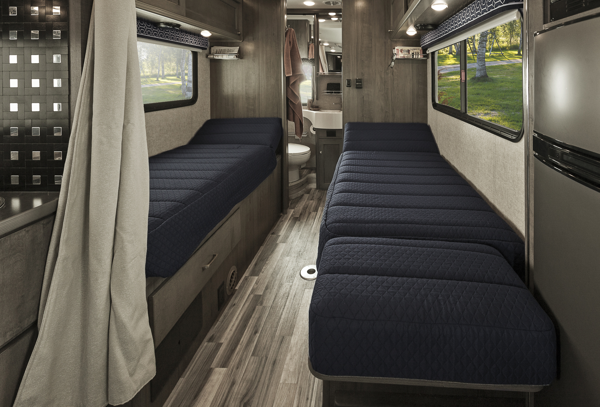 Winnebago Fuse interior showing the two twin beds and bathroom at the back.