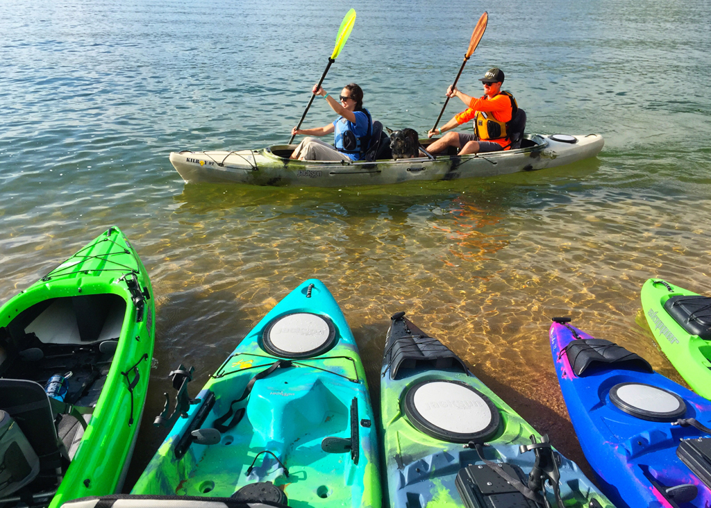 Two people in a kayak on the water.