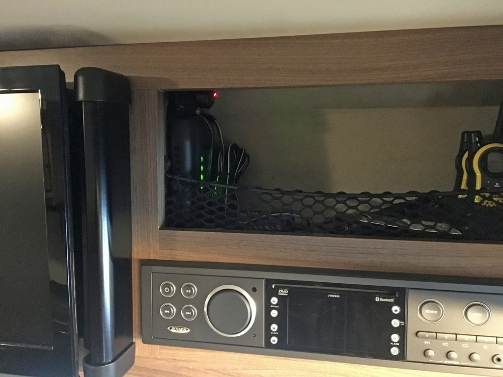 weBoost unit in RV in compartment above radio.